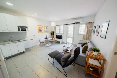 a living room with a couch and a table at rentBCN Paseo de Gracia Apartments in Barcelona