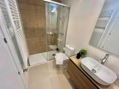a bathroom with a shower and a sink and a toilet at Atico Barcelona Playa in Sant Adria de Besos