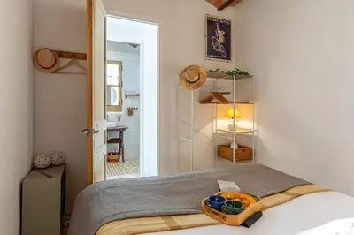 a bedroom with a bed with a tray of food on it at 2088 - AB Sagrada Familia in Barcelona