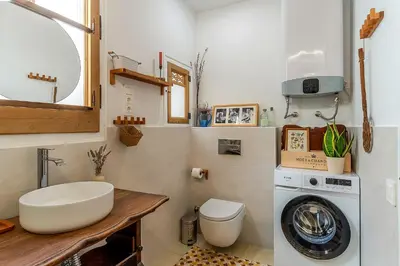 a bathroom with a washing machine and a sink at 2088 - AB Sagrada Familia in Barcelona