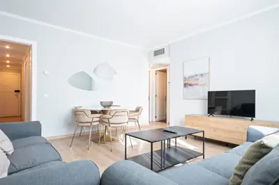 a living room with a couch and a table at Alcam Mallorca 22 in Barcelona
