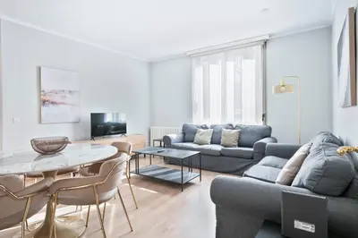 a living room with a couch and a table at Alcam Mallorca 22 in Barcelona