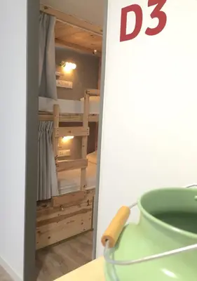 a room with a bunk bed and a green vase at Ant Hostel Barcelona in Barcelona