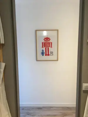 a picture hanging on a wall in a room at Ant Hostel Barcelona in Barcelona