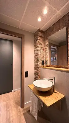 a bathroom with a sink and a mirror at La Fira - Paralelo 2 in Barcelona