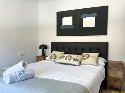 a kitchen with a wooden counter top in a room at PalmBreeze in Vilanova i la Geltrú