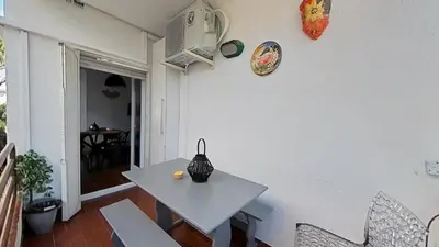 a white table and chairs in a room at For Sea Lovers in Cubelles