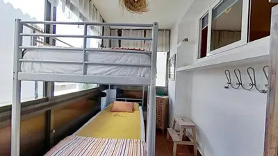 a bunk bed in a small room with a bunk bed in a building at For Sea Lovers in Cubelles