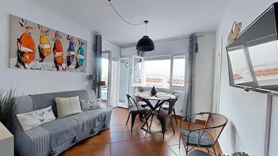 a living room with a couch and a table at For Sea Lovers in Cubelles