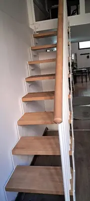 a staircase with wooden steps in a room at Casa Gracia con Jardín in Barcelona