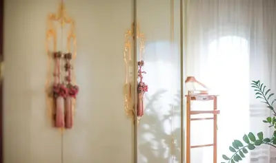 a room with two clocks on the wall at Hotel Boutique Edelweiss La Garriga in La Garriga