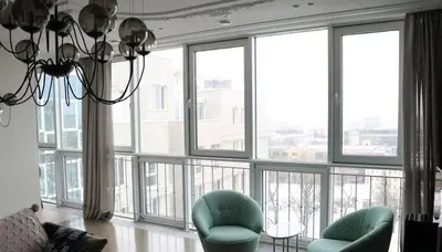 a living room with a chandelier and large windows at Casa o chalet independiente en venta en Sarrià in Sant Just Desvern