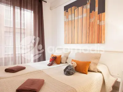 two beds with stuffed animals sitting on them in a bedroom at Ideal Location in L'Eixample! - Walk to Sagrada Familia and Barcelona Old Town! in Barcelona