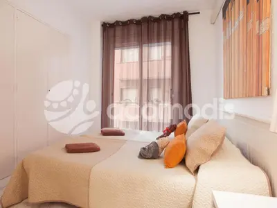 two beds in a bedroom with two stuffed animals on the bed at Ideal Location in L'Eixample! - Walk to Sagrada Familia and Barcelona Old Town! in Barcelona