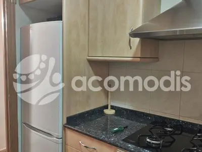 a kitchen with a refrigerator and a counter top at Passatge Concepcio in Hospitalet de Llobregat