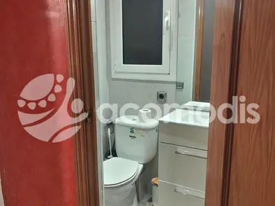 a bathroom with a toilet and a sink and a mirror at Passatge Concepcio in Hospitalet de Llobregat