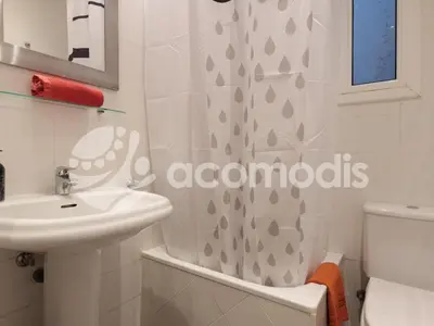 a bathroom with a sink and a shower curtain at Vigatans in Barcelona