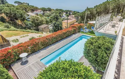 an overhead view of a swimming pool in a yard at 5 Bedroom Amazing Home In Cabrils in Cabrils