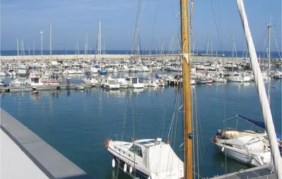 a bunch of boats are docked in a marina at 5 Bedroom Amazing Home In Cabrils in Cabrils