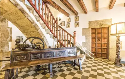 aoyer with a staircase and a bench in a room at Nice Home In Arenys De Munt in Arenys de Munt