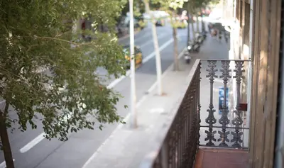 a balcony of a building with a view of a street at Apartamento 4 dormitorios en Calle Roselló You Stylish Apartments in Barcelona