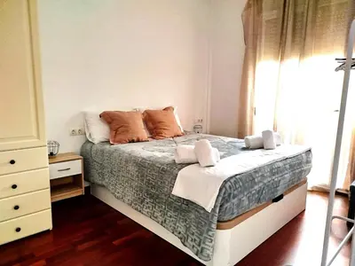 a living room with a couch and a table at La Tranquilidad en Sabadell in Sabadell