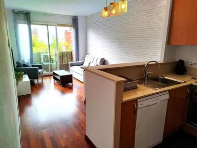 a bedroom with a bed and a large window at La Tranquilidad en Sabadell in Sabadell