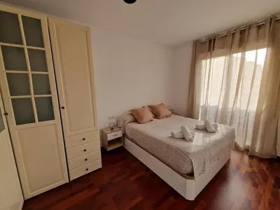 a bedroom with a bed with two pillows on it at La Tranquilidad en Sabadell in Sabadell