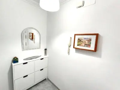 a bathroom with a white dresser and a mirror at CUNIT PLaYA in Cunit