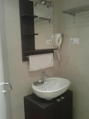 a bathroom with a white sink and a mirror at BruStar Sagrada Familia in Barcelona