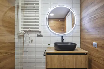 a bathroom with a black sink and a mirror at BBarcelona Mallorca Flats in Barcelona