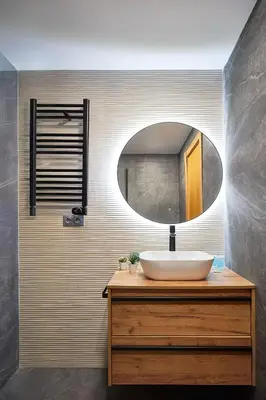 a bathroom with a sink and a mirror at BBarcelona Mallorca Flats in Barcelona