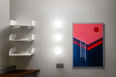 a painting with a ladder on a wall with shelves at BYPILLOW Flamant in Barcelona