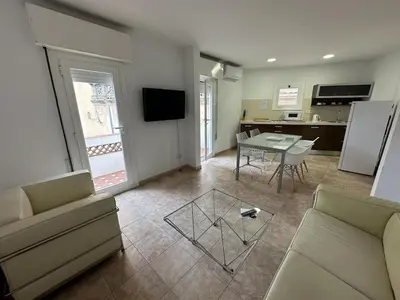 a living room with a couch and a table at LEsglesia 1 in Arenys de Mar