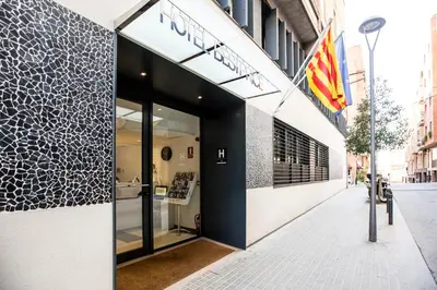 a store front of a building with a flag at Hotel BESTPRICE Gracia in Barcelona