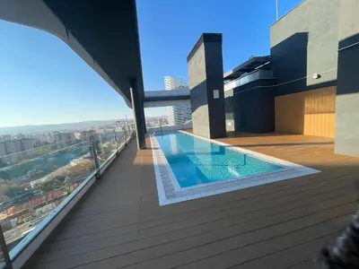 a swimming pool on the roof of a building at Piso luminoso en Hospitalet de Llobregat in Barcelona