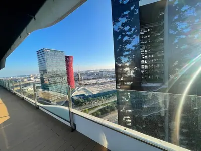 a view of a city from a balcony of a building at Piso luminoso en Hospitalet de Llobregat in Barcelona