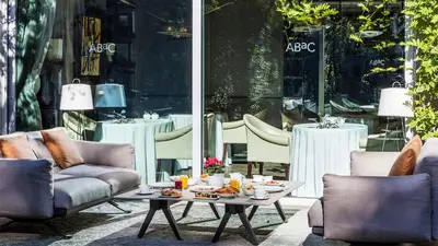 a room with a table with food on it at ABaC H&R Barcelona Monument in Barcelona