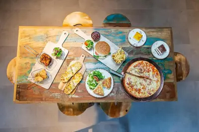 a table with a bunch of food on it at Safestay Barcelona Passeig de Gràcia in Barcelona