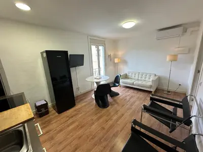 a living room with a couch and a table at Esglesia 2 in Arenys de Mar