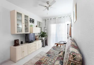 a living room with a couch and a tv at Perfect Apartment near the beach and Barcelona in Pineda de Mar