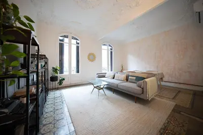 a living room with a couch and a table at Stylish Retreat in Catalonia in Barcelona