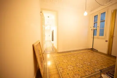 an empty hallway with a door and a tile floor at Stylish Retreat in Catalonia in Barcelona