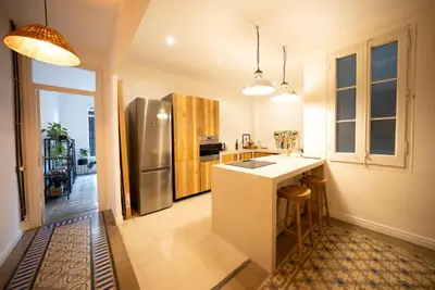a kitchen with a stainless steel refrigerator and a counter at Stylish Retreat in Catalonia in Barcelona