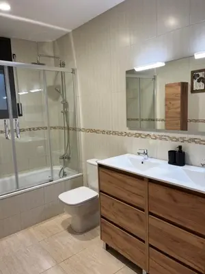 a bathroom with a sink and a toilet and a shower at Can Sura in Campíns