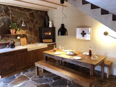 a kitchen with a wooden table and a stove at Catalunya Casas Unique villa in Costa Maresme 27km to Barcelona! in Argentona
