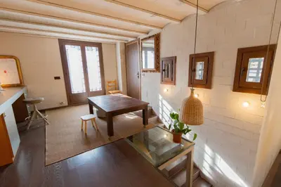 a room with a table and a bench in a room at Catalunya Casas Unique villa in Costa Maresme 27km to Barcelona! in Argentona