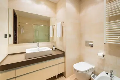 a bathroom with a sink and a toilet at InSitges Center in Sitges