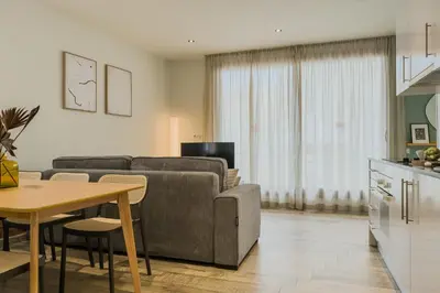 a living room with a couch and a table at Novus Homes Barcelona Plaza España in Barcelona