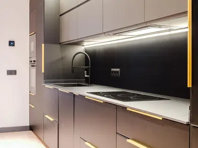 a kitchen with stainless steel cabinets and a sink at Luxury 2 Story Apartment Near Passeig de Gracia in Barcelona